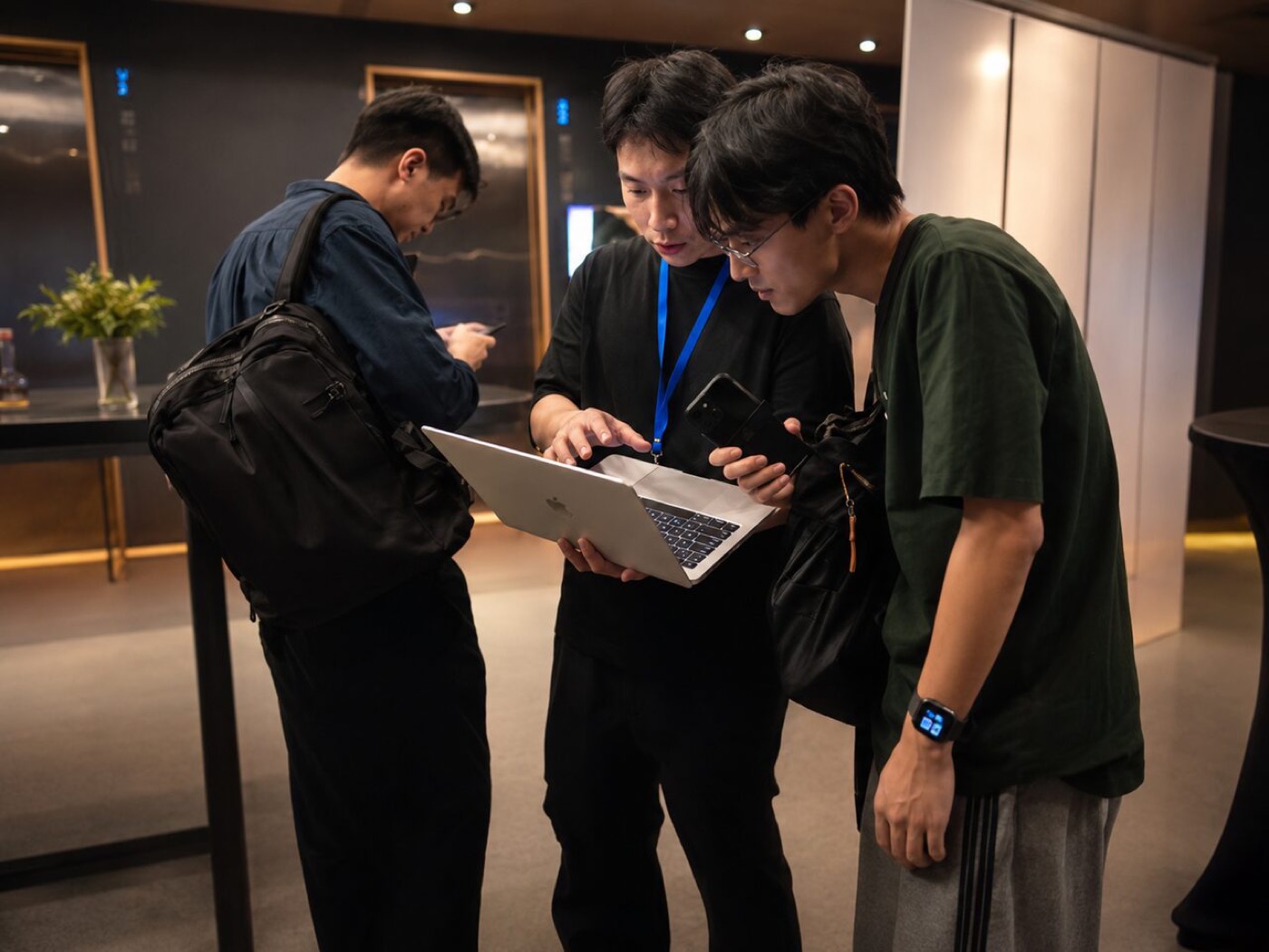 A group building together on laptops