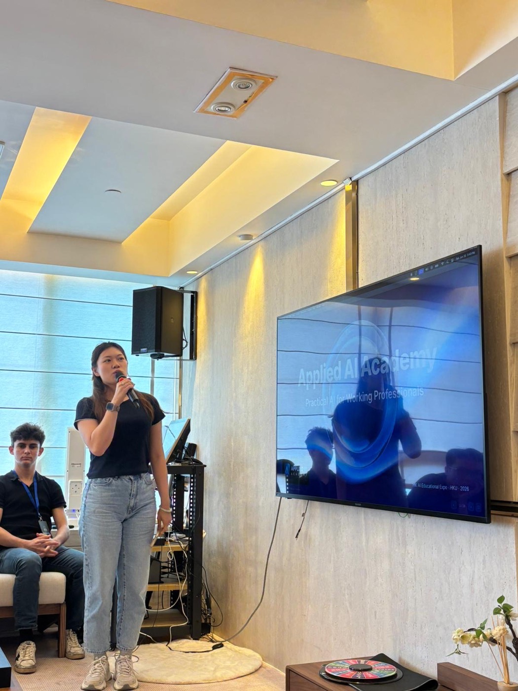A builder demoing their project on stage