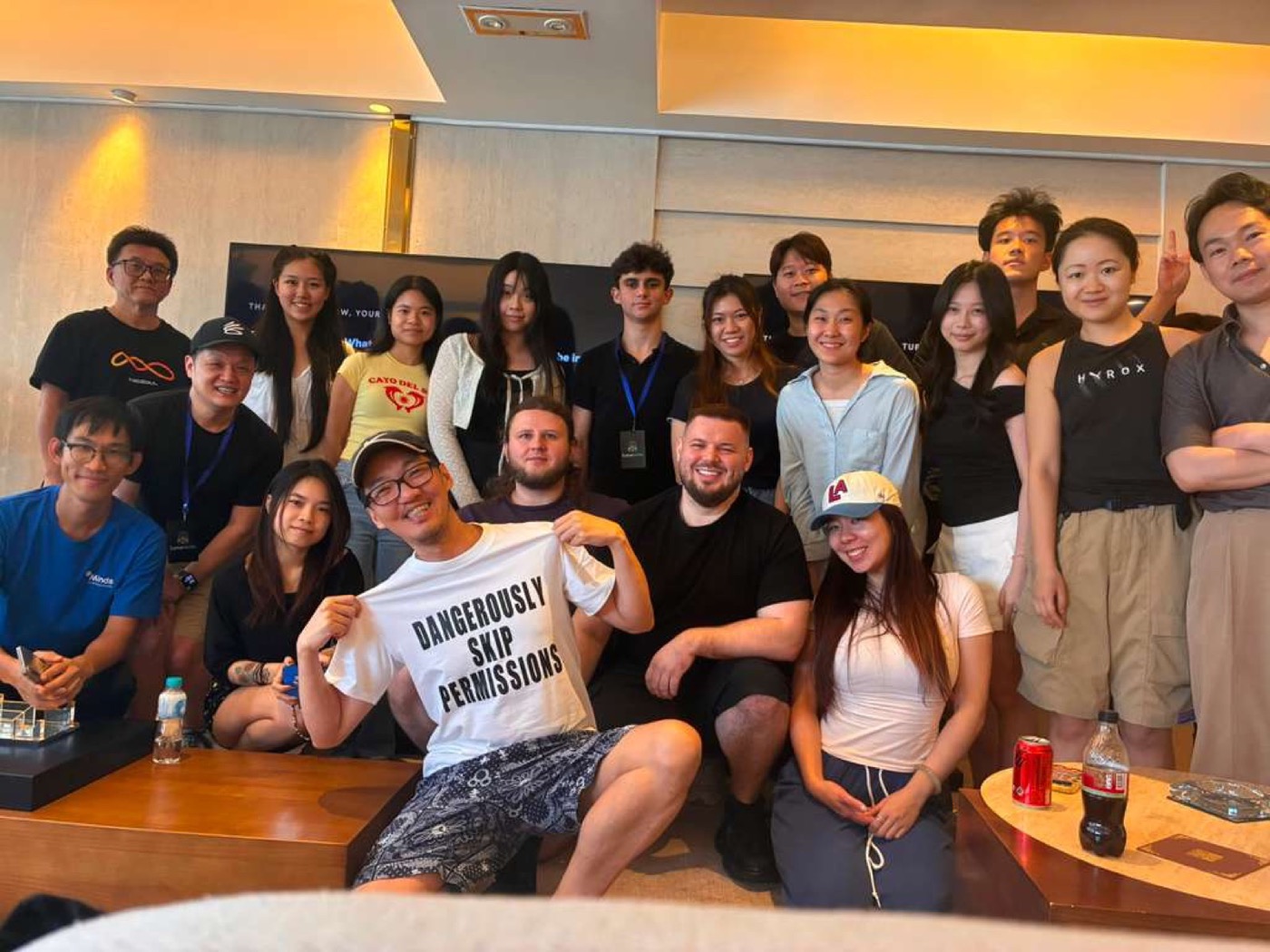 A standing group photo of attendees