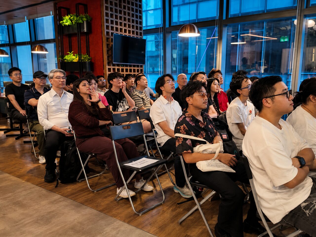 Rows of attendees seated for the talks