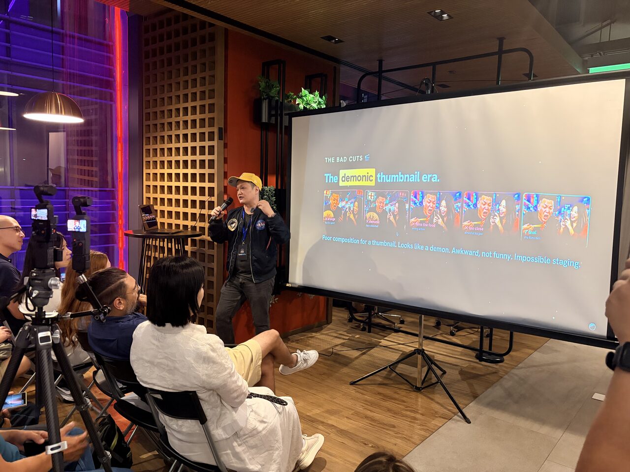 The room watching an AI short film on the big screen