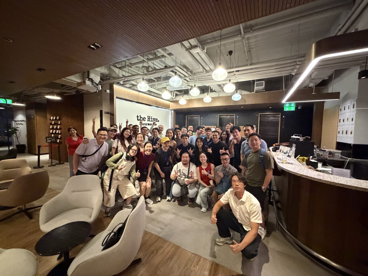 The crew who stayed till kick-out, gathered under the the Hive signage